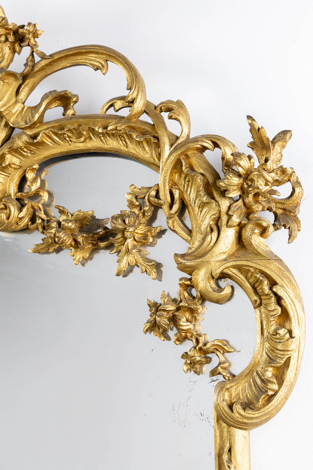 An antique wood-sculptured mirror, Louis XV style. Circa 1900. (W:93 x H:135 cm)