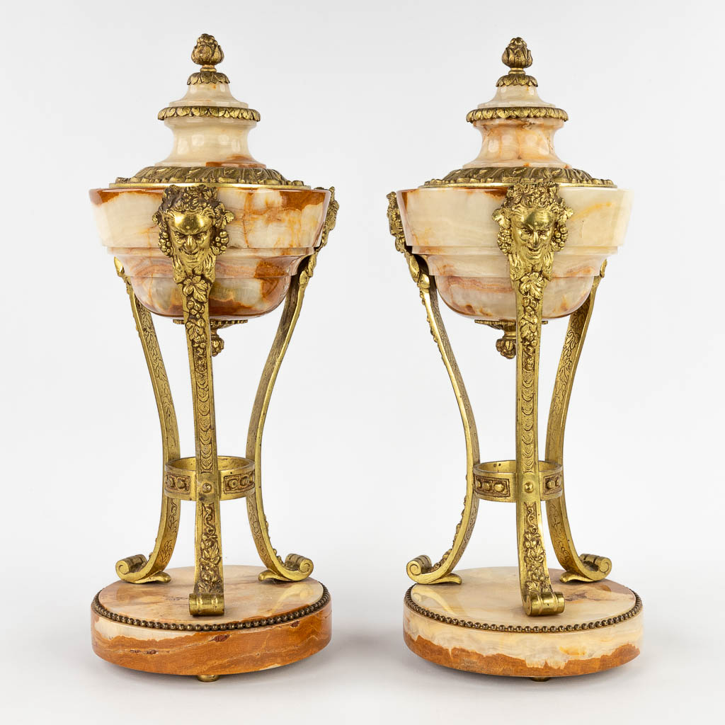 A pair of cassolettes, onyx mounted with bronze in Louis XVI style. Circa 1900. (H:45 x D:18 cm)