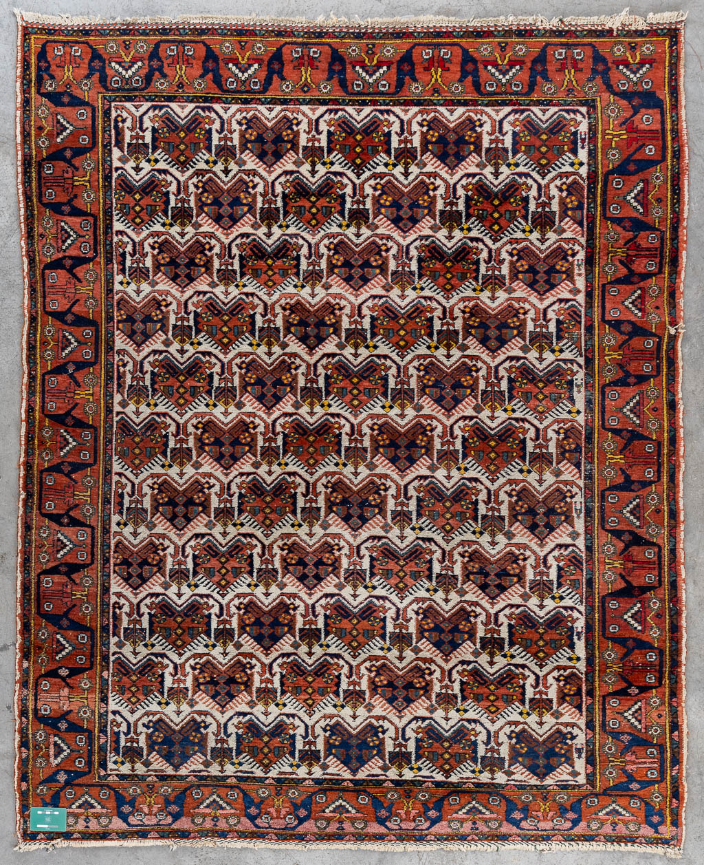 A Geometric Oriental hand-made carpet. (L:192 x W:157 cm)