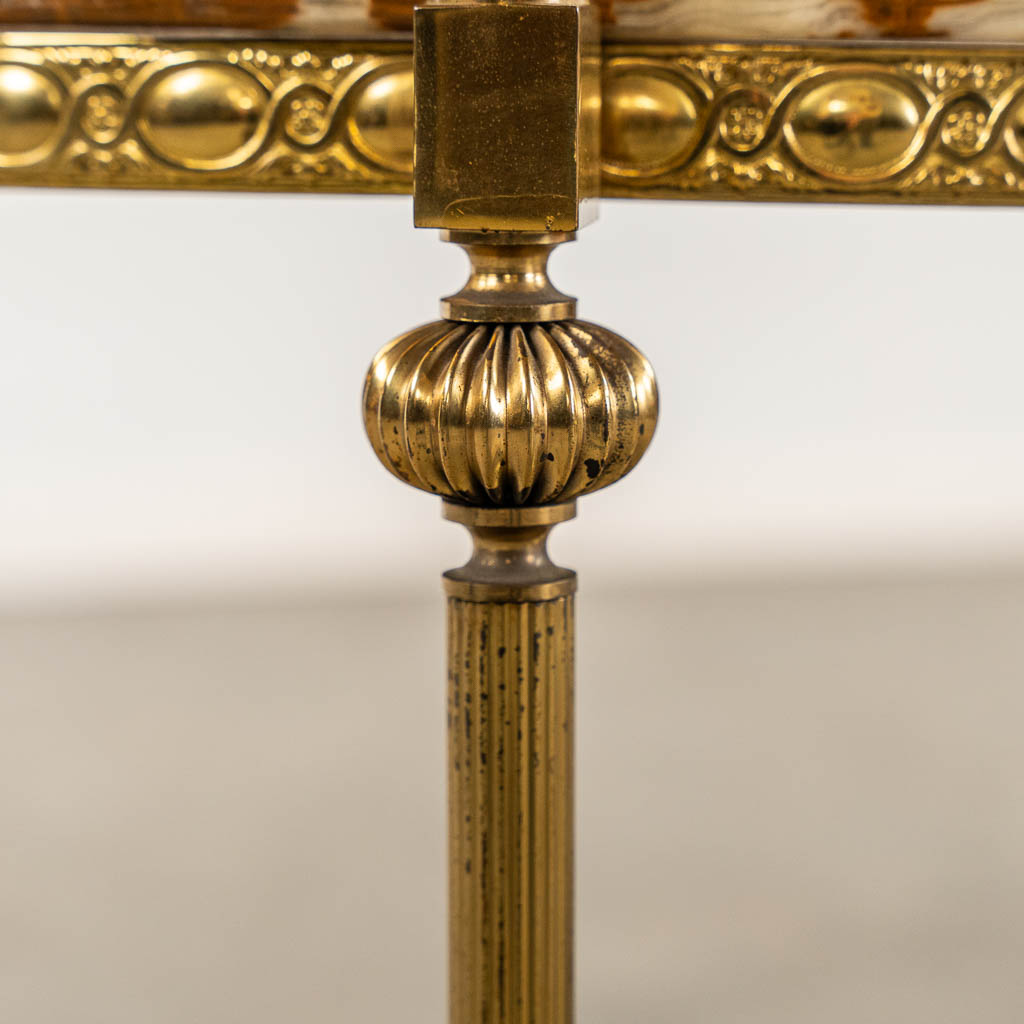 A set of three nesting tables, onyx and brass. 20th C. (H:46 x D:51 cm)