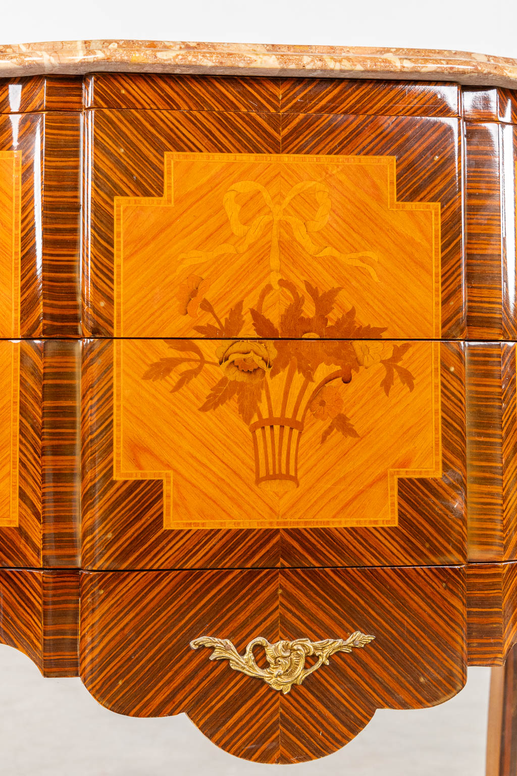 A two drawer side cabinet, marquetry inlay with a marble top. (L:39 x W:72 x H:81 cm)