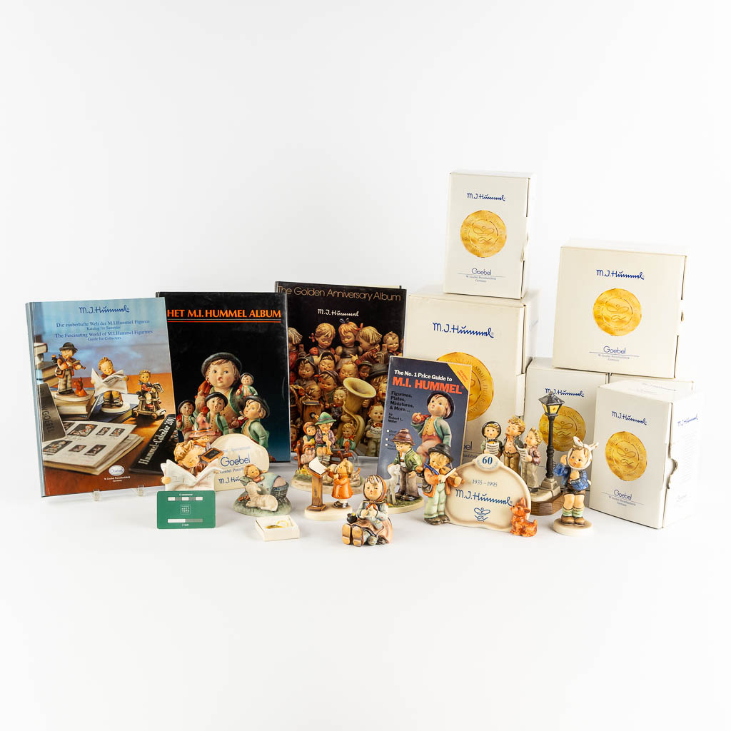 Hummel, 9 figurines with original boxes and 3 books + catalogs. (H:18 cm)