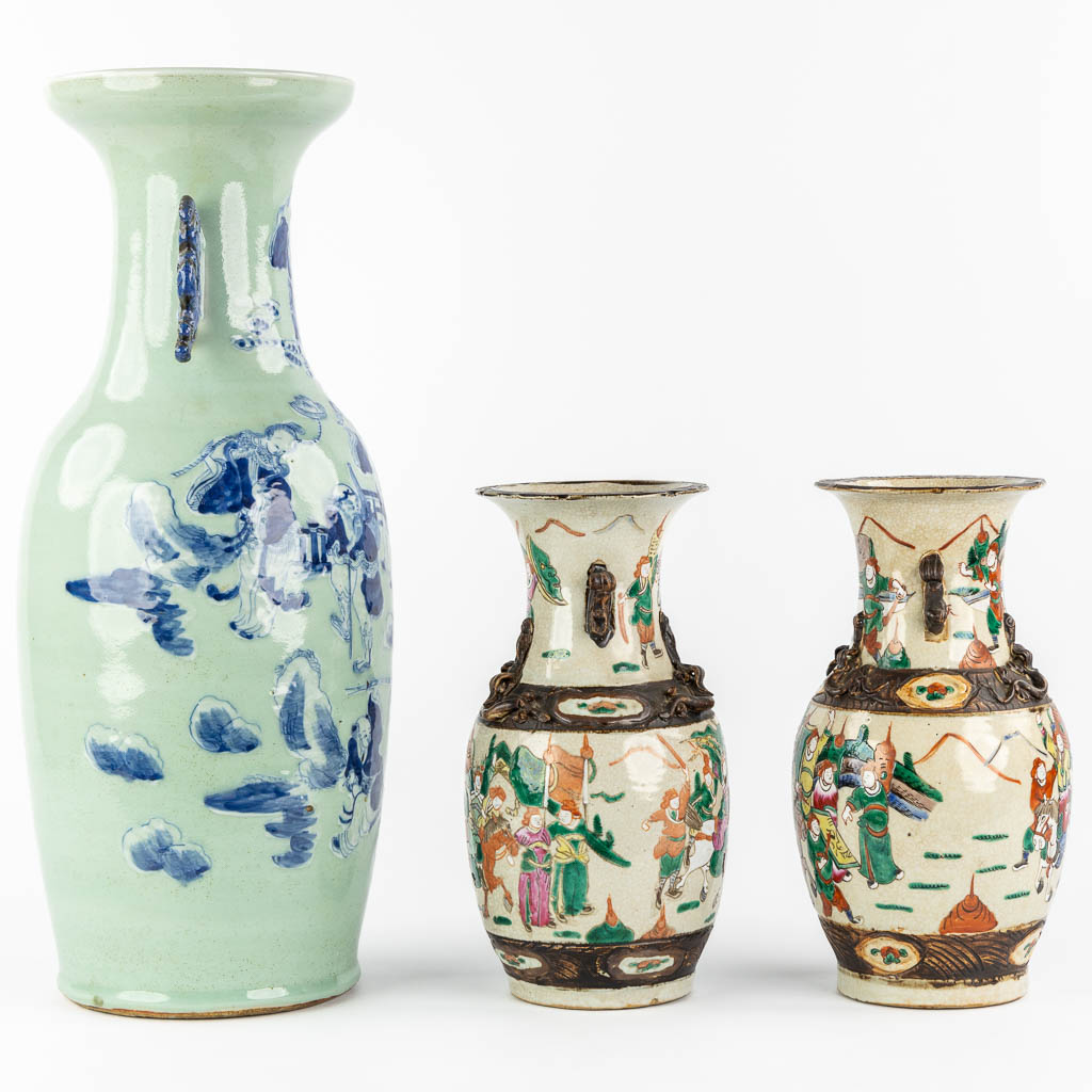 A Chinese vase blue-white decor of the Eight Immortals, added a pair of Nanking vases. (H:61 x D:23 cm)