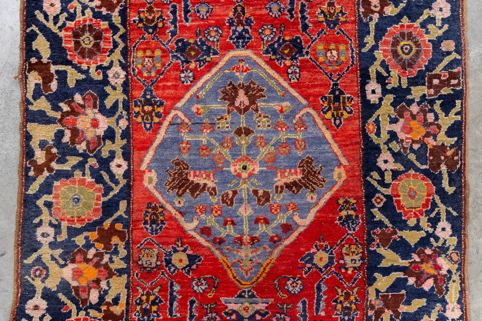 An Oriental hand-made carpet, dated 1939.. (W:124 x H:196 cm)