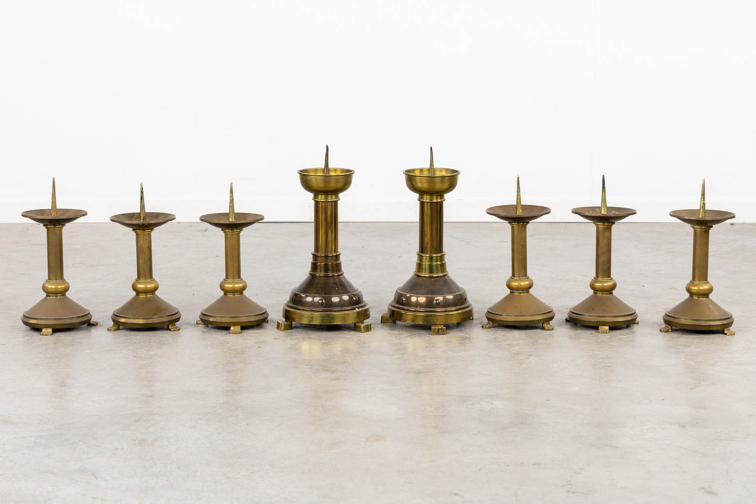 Thirteen Chruch candlesticks, brass and bronze. (H:40 cm)