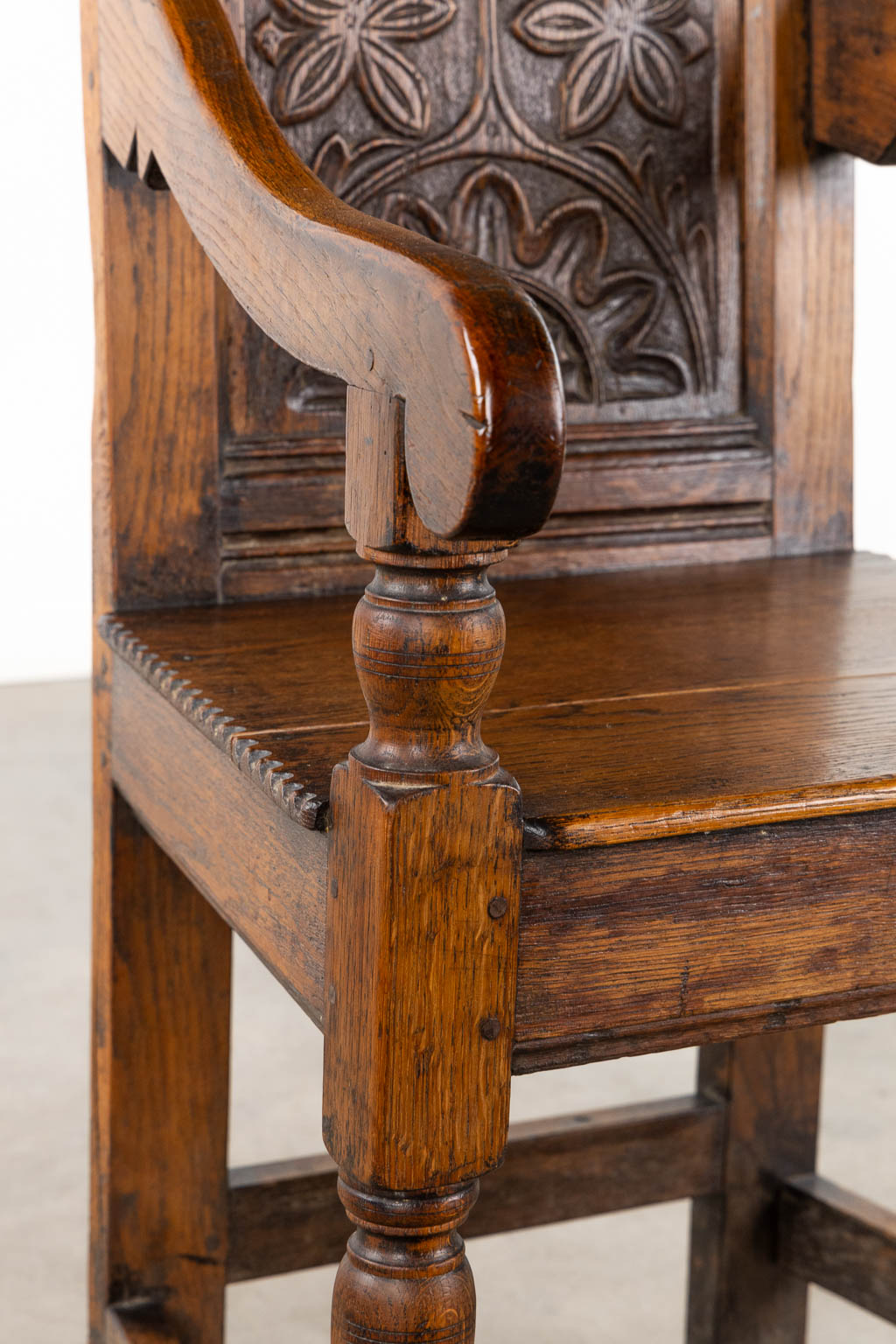 A wood-sculptured armchair, Flanders, 18th C. (L:55 x W:55 x H:117 cm)