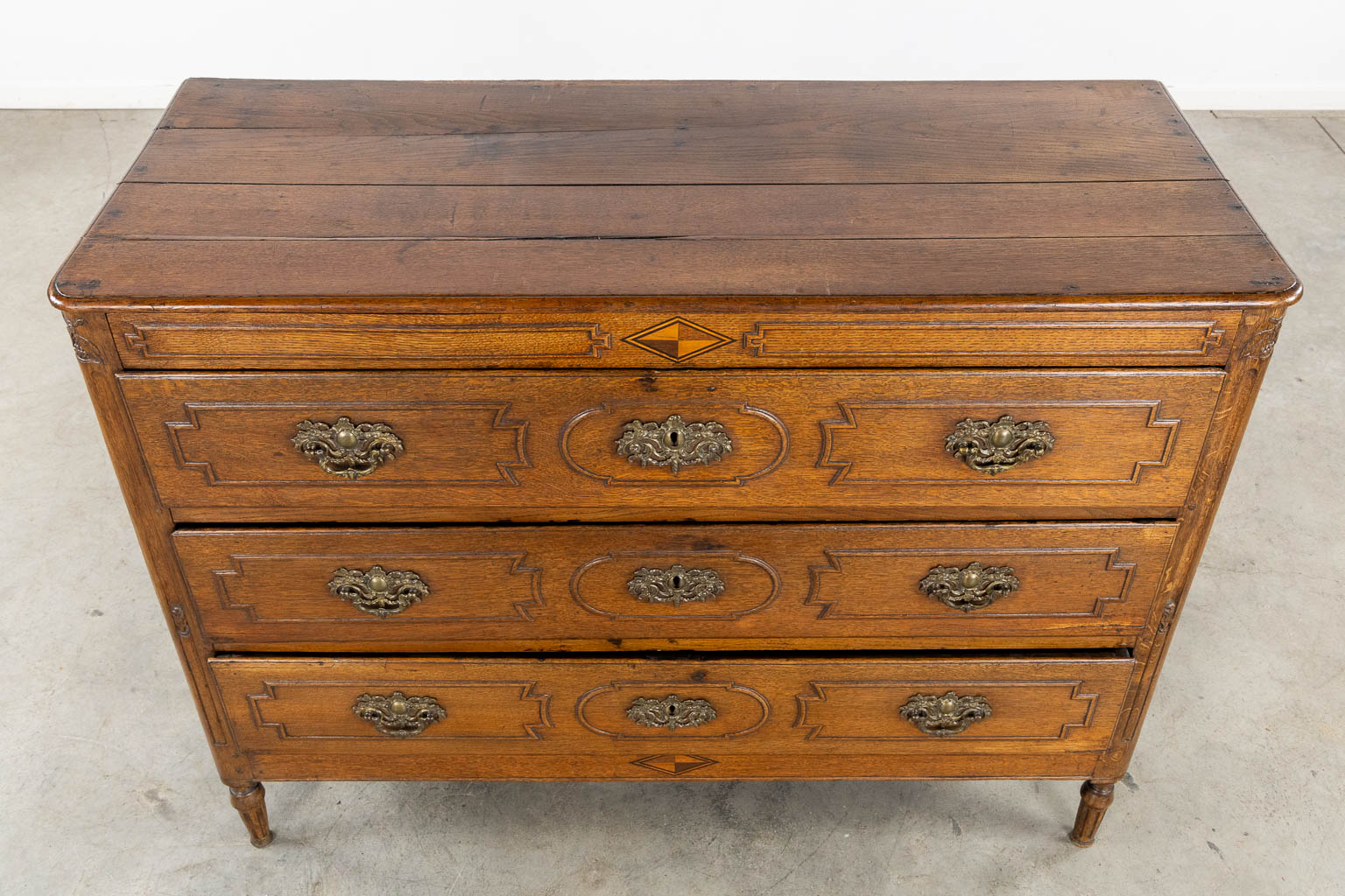 A three-drawer commode, Louis XVI. 18th C. (L:55 x W:132 x H:99 cm)