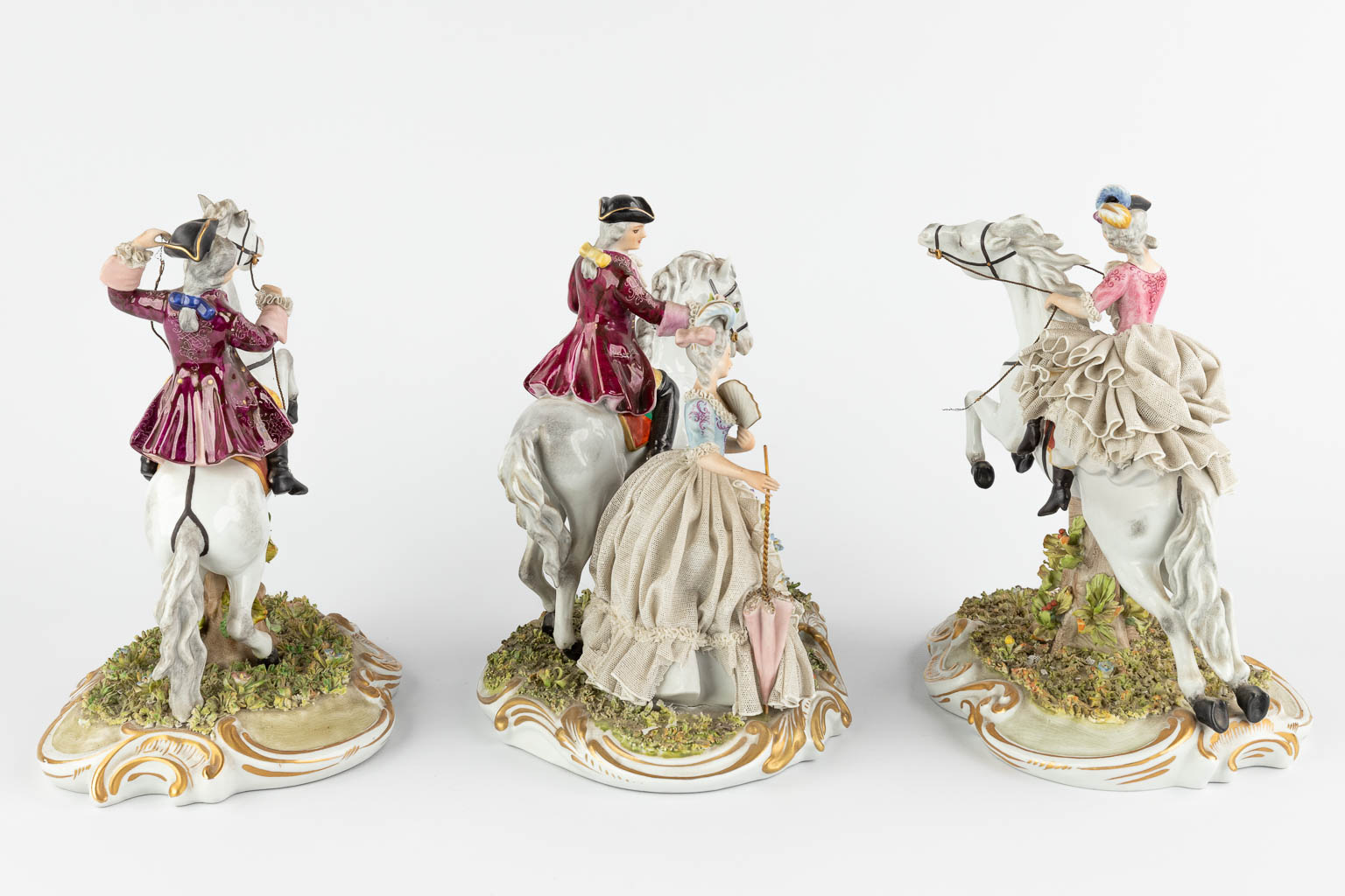 Capodimonte, three groups with horses, 20th C. (W:22 x H:26 cm)