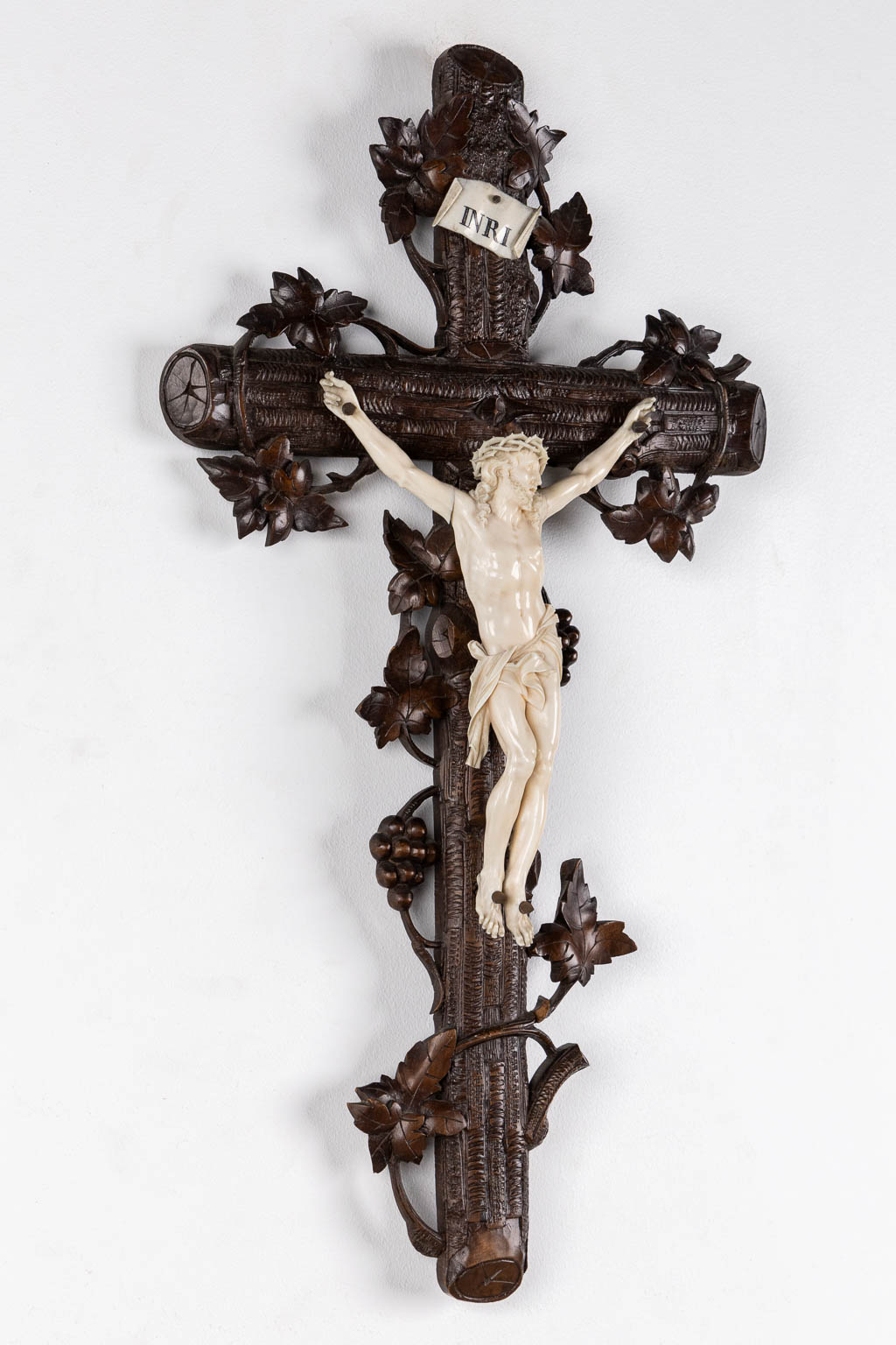 A wood-sculptured crucifix with an ivory 