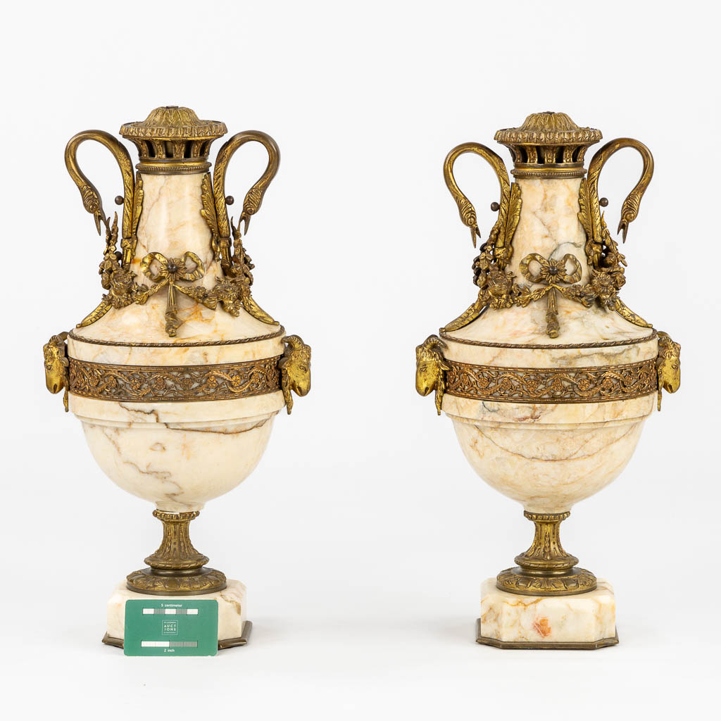 A pair of marble cassolettes, marble mounted with bronze in Louis XVI style. Ram