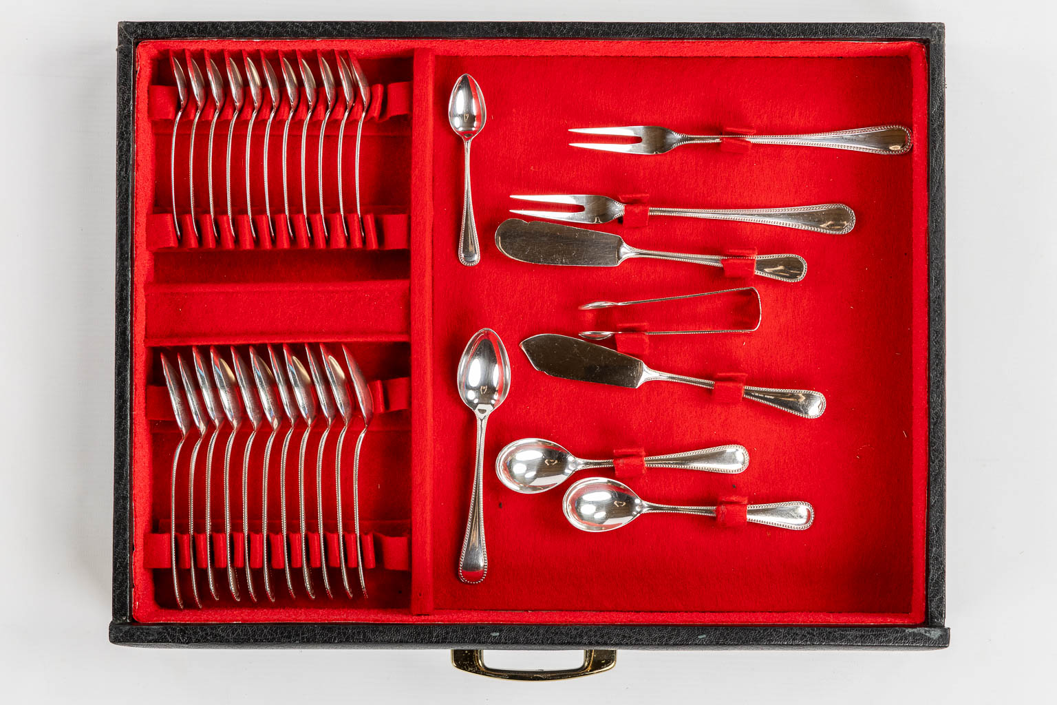 A 184-piece silver-plated cutlery with a Perles decor. (L:36 x W:47 x H:37 cm)