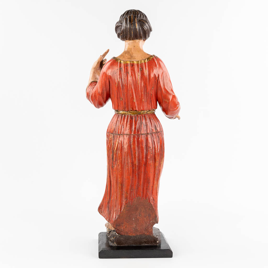 An antique wood-sculptured and polychrome figurine of a noble lady. 18th/19th C. (L: 20 x W: 25 x H: 60 cm)