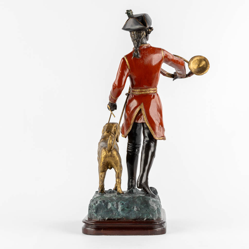 After Pierre Jules Mène, Hunter with his horn and dog. Patinated bronze. (L:29 x W:35 x H:62 cm)