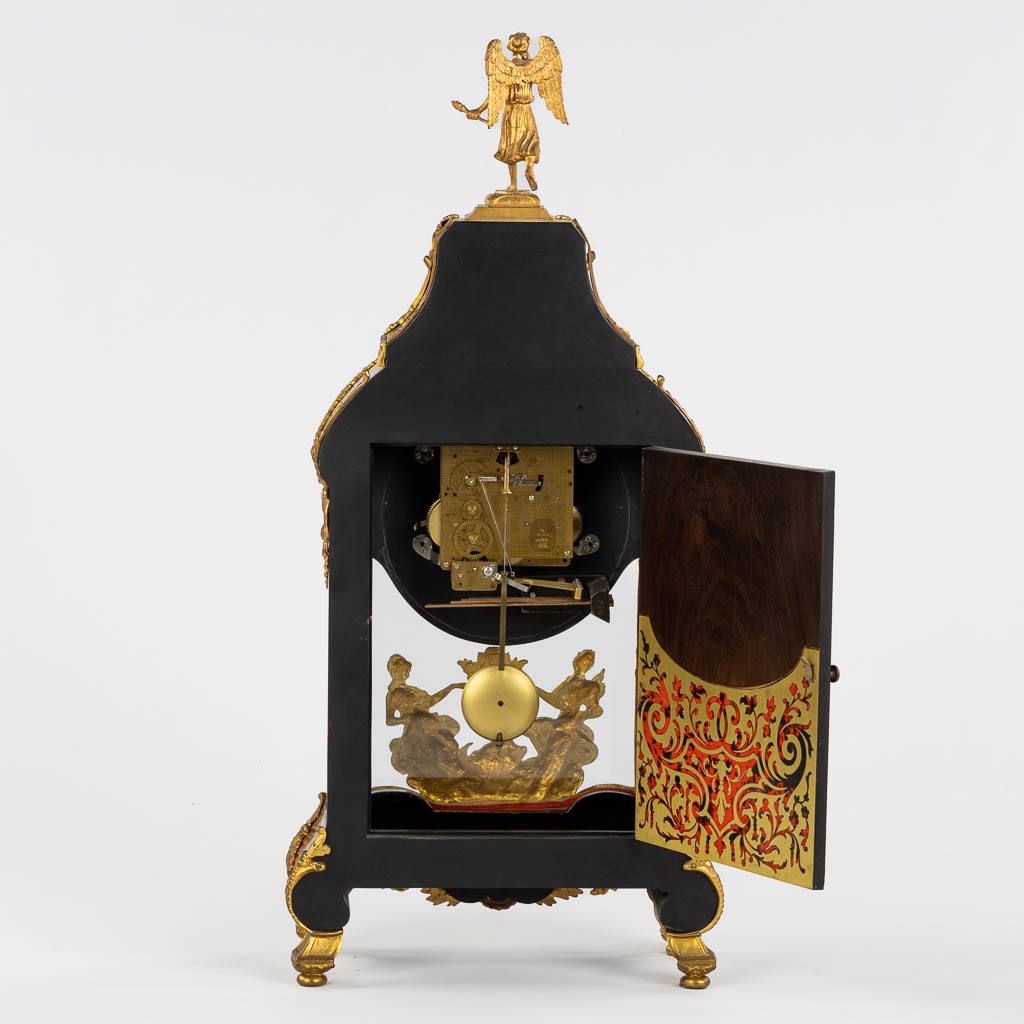 A large cartel clock, Faux Boulle in a Napoleon 3 style, mounted with gilt bronze. 20th C. (L:15 x W:40 x H:85 cm)