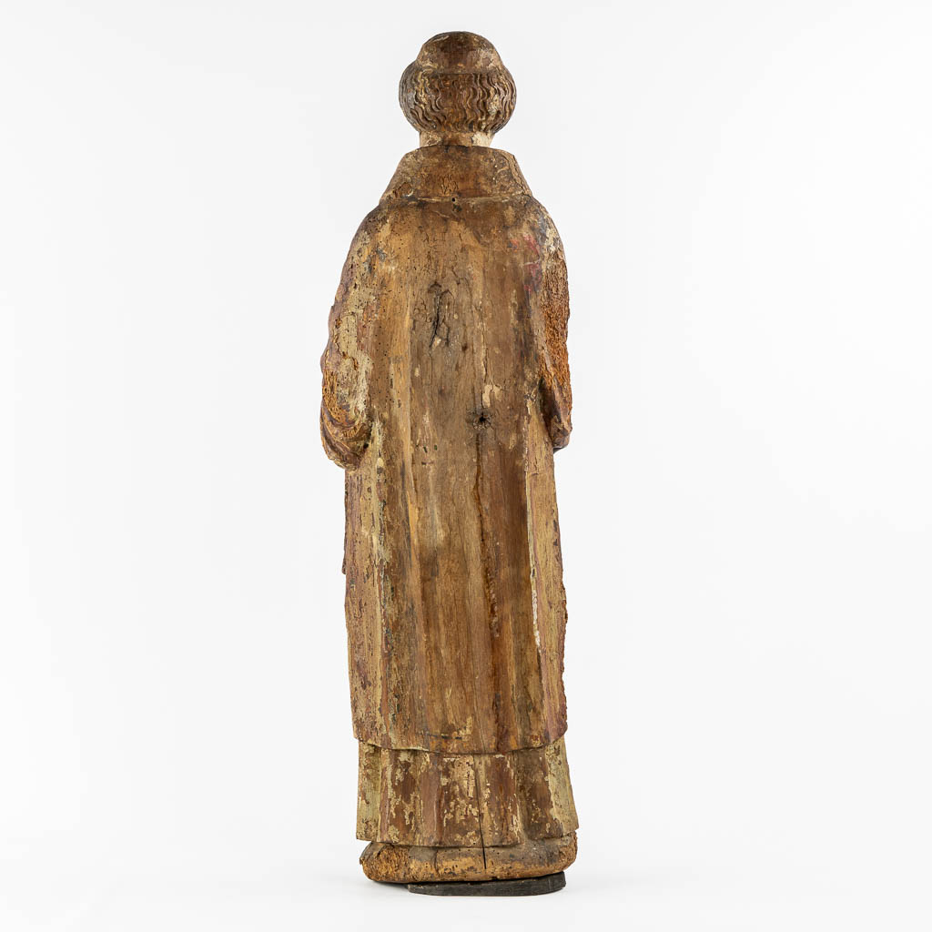 Saint Laurentius, Deacon. A wood-sculpture, oak, 14th C.  (L:20 x W:25,5 x H:90 cm)