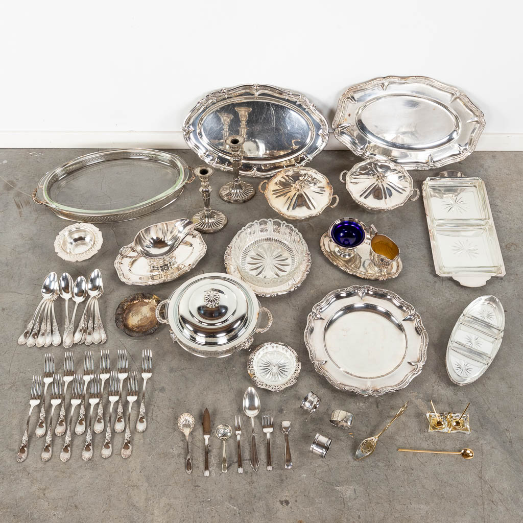 A collection of table accessories and serve ware, silver-plated metal and glass. (L:31,5 x W:46 cm)