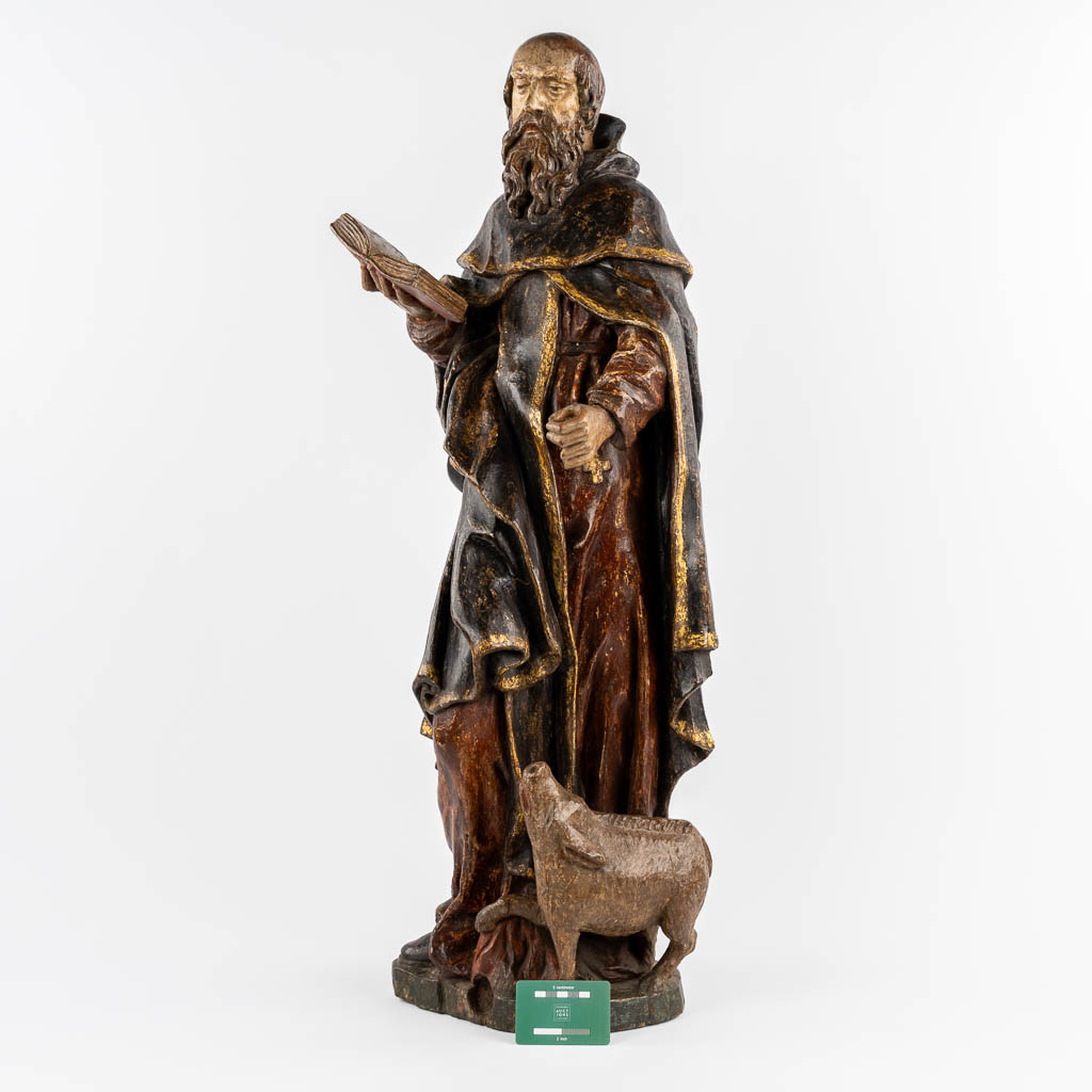 An antique wood-sculptured figurine of Saint Anthony the Great, with a pig. 18th C.