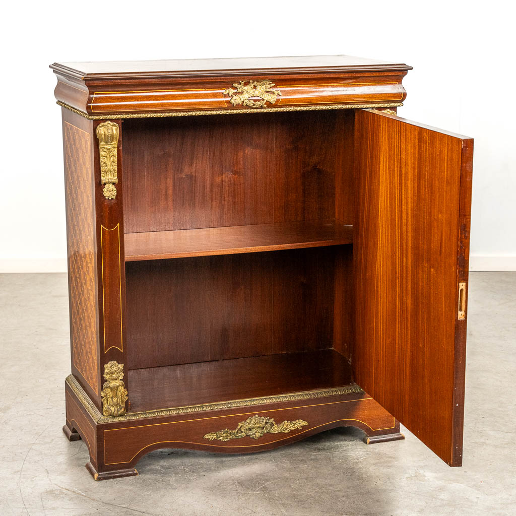 A single door cabinet, marquetry inlay mounted with bronze. 20th C. 