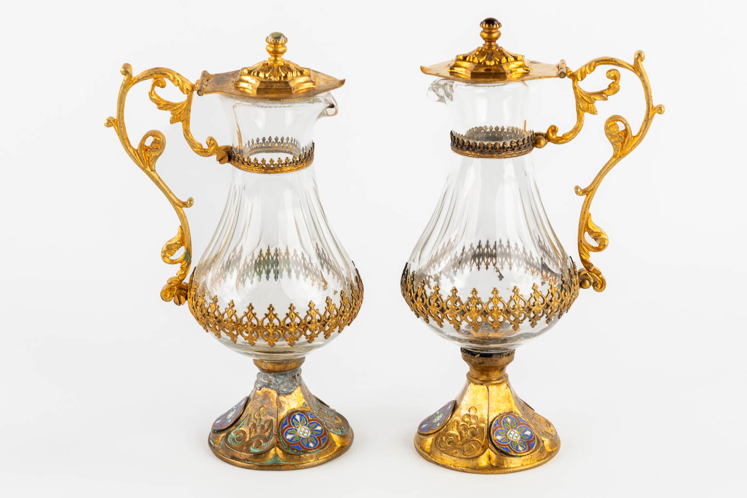 A pair of wine and water cruets, gold-plated metal and enamel. Gothic Revival. 