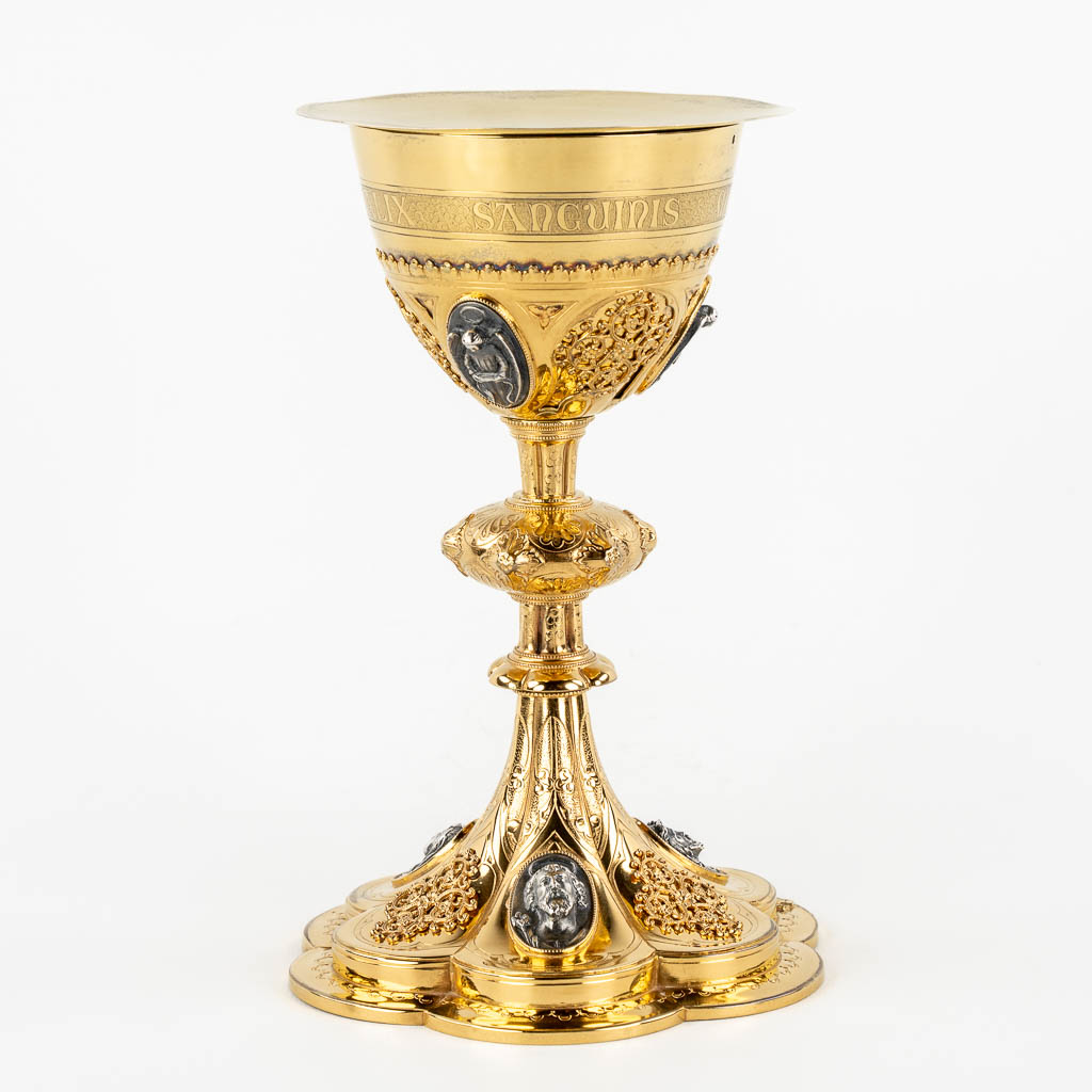 A Gothic Revival chalice with enamel plaques, cabochons. Silver Cuppa, Gilt brass, 19th C.