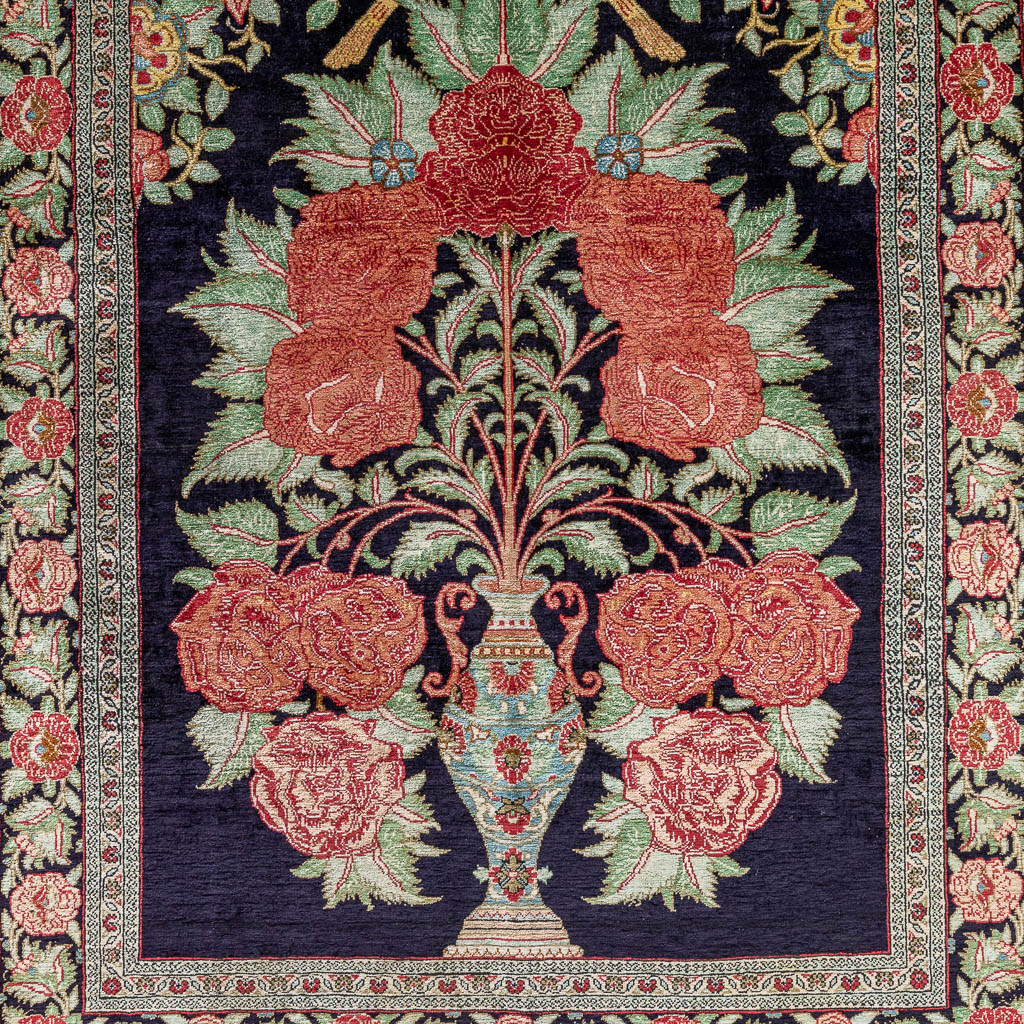 An antique Oriental hand-made carpet, silk. (L: 128 x W: 84 cm)