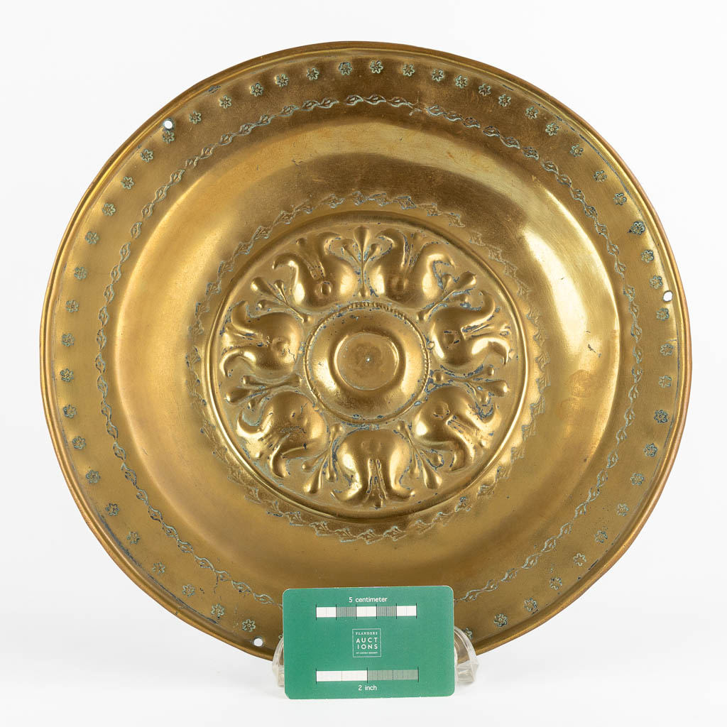 A brass Alms Dish depicting 