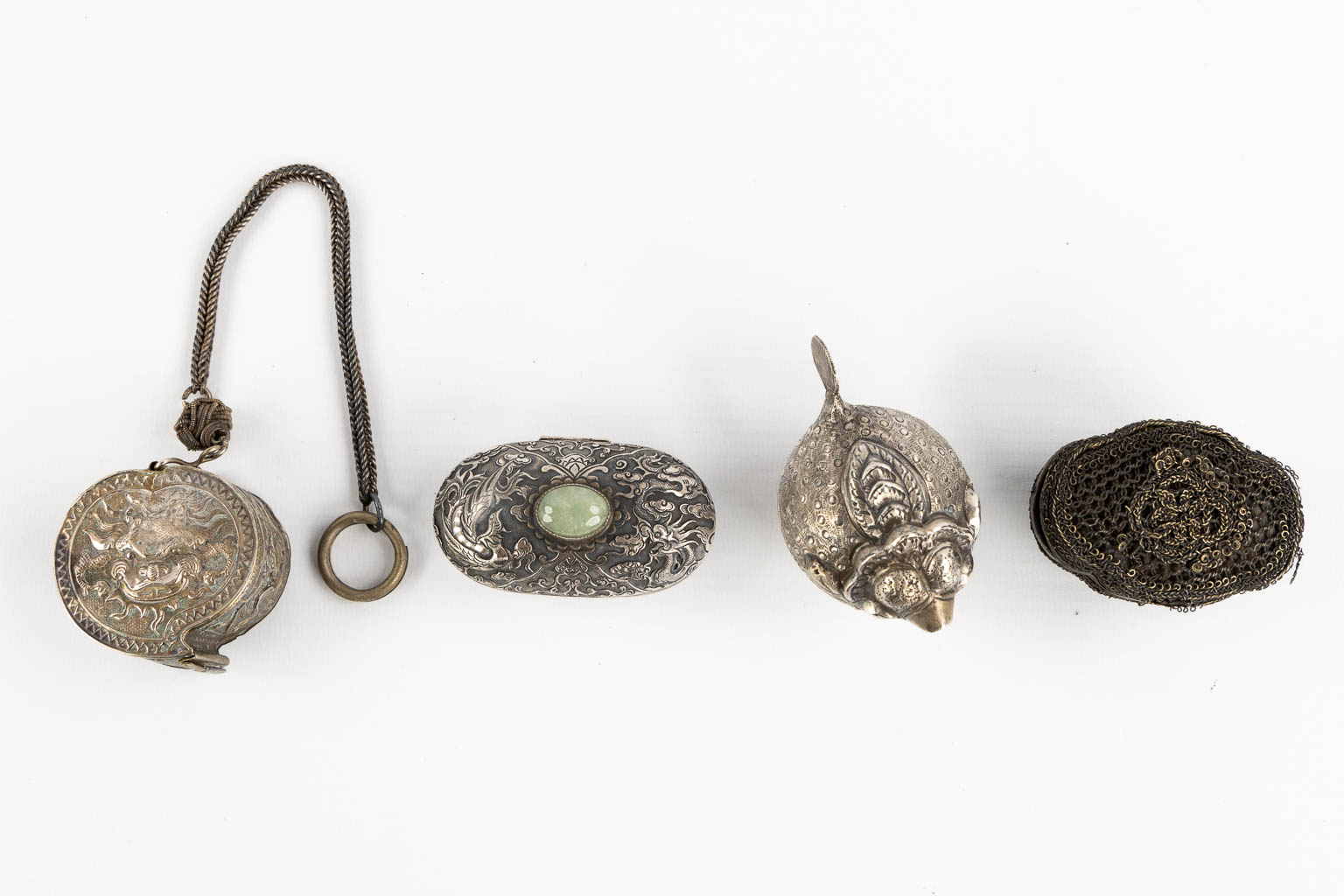 Fourteen Islamic and Indian Amulet or Trinklet boxes, Silver and silver-plate. 19th/20th C. (L:9,5 x W:16,5 x H:2,5 cm)