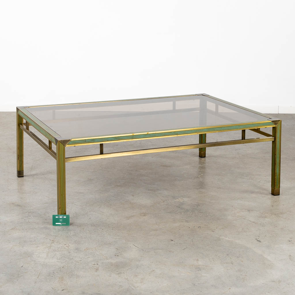 A mid-century coffee table, brass and glass in the style of Belgo Chrome. (L:88 x W:128 x H:43 cm)