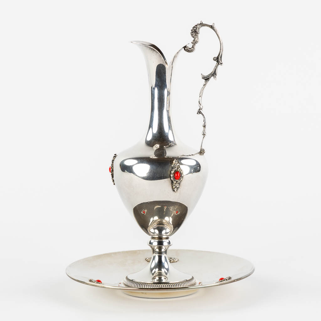 A pitcher on a saucer, silver mounted with cabochons. 800/1000. (H:22 x D:16 cm)