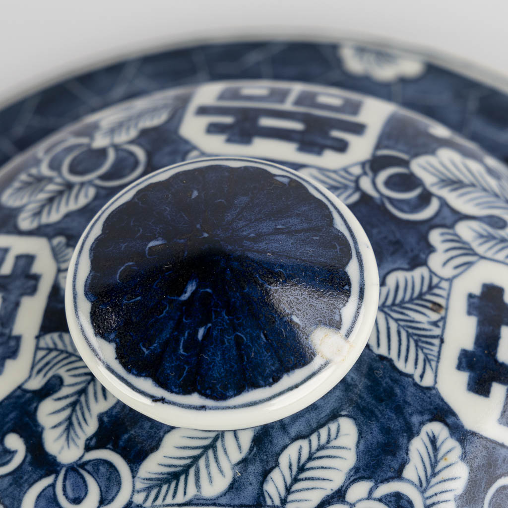 A Chinese baluster vase, blue-white with a Prunus decor and double XI sign. 19th/20th C. (H:42 x D:26 cm)