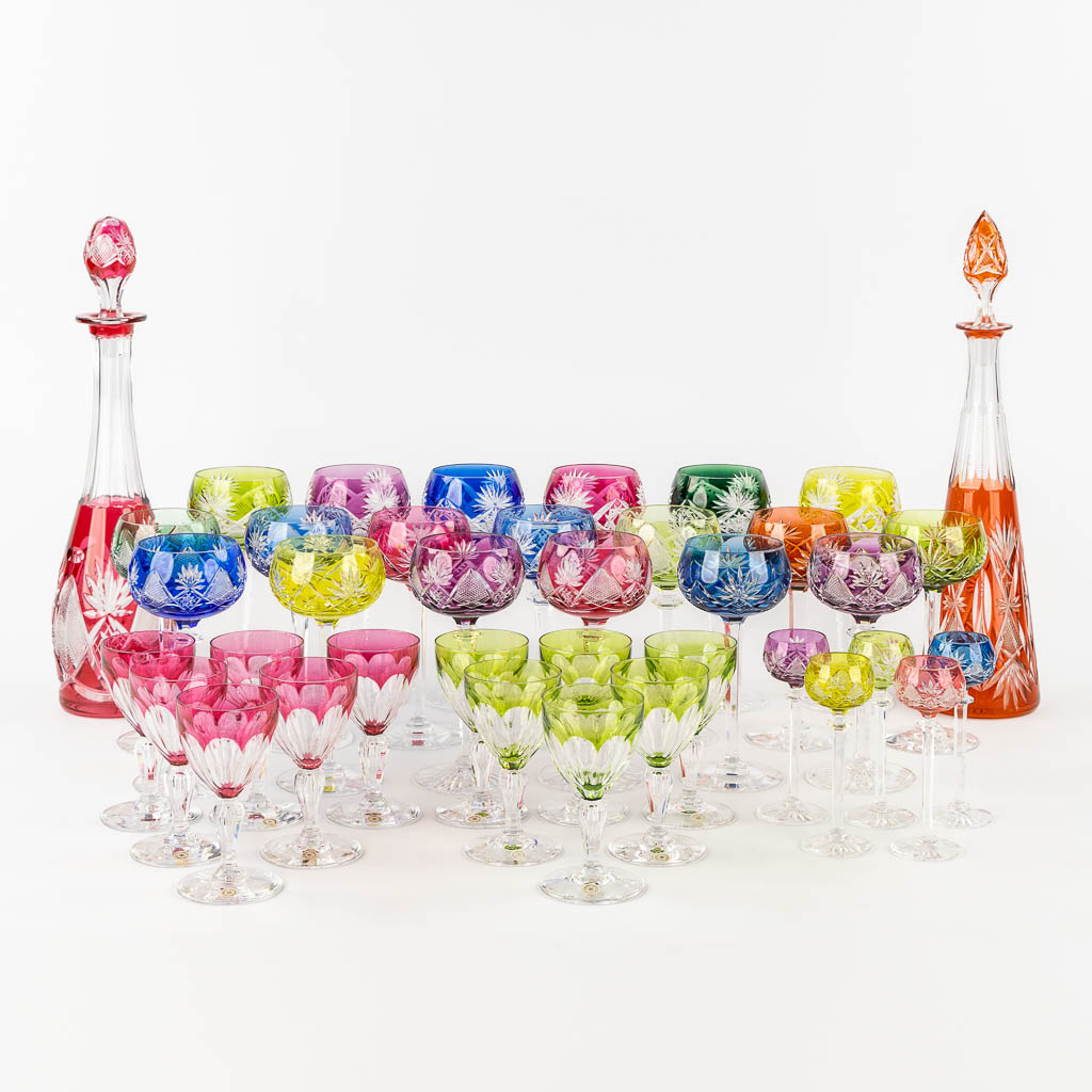 Val Saint Lambert, 36 coloured goblets and two carafes. 