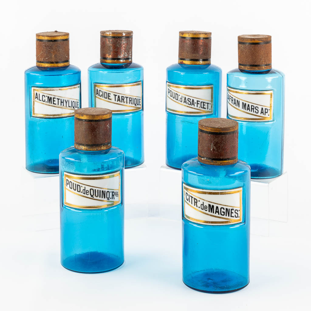 Six blue glass Pharmacy bottles with enamel plaques, circa 1880-1900. (H:23,5 x D:9,5 cm)