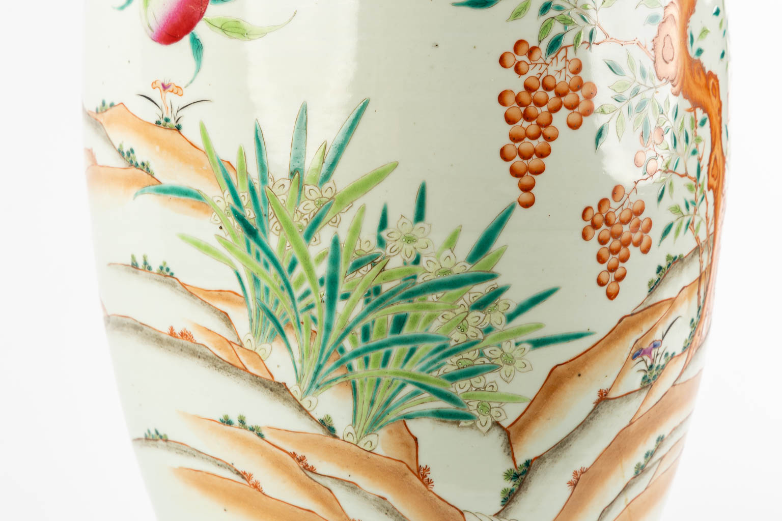 A large Chinese Famille Rose vase with a peach decor and elephant handles. 19th C. (H:70 x D:34 cm)