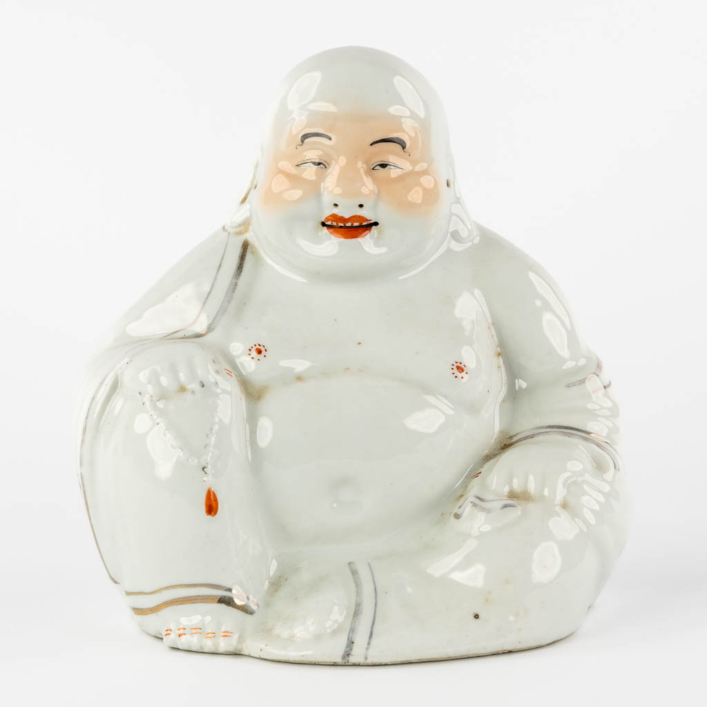 A Chinese Smiling Buddha, glazed porcelain. 