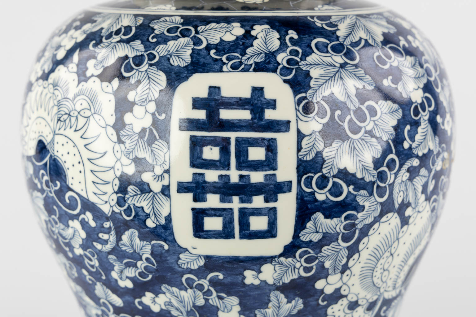 A Chinese baluster vase, blue-white with a Prunus decor and double XI sign. 19th/20th C. (H:42 x D:26 cm)