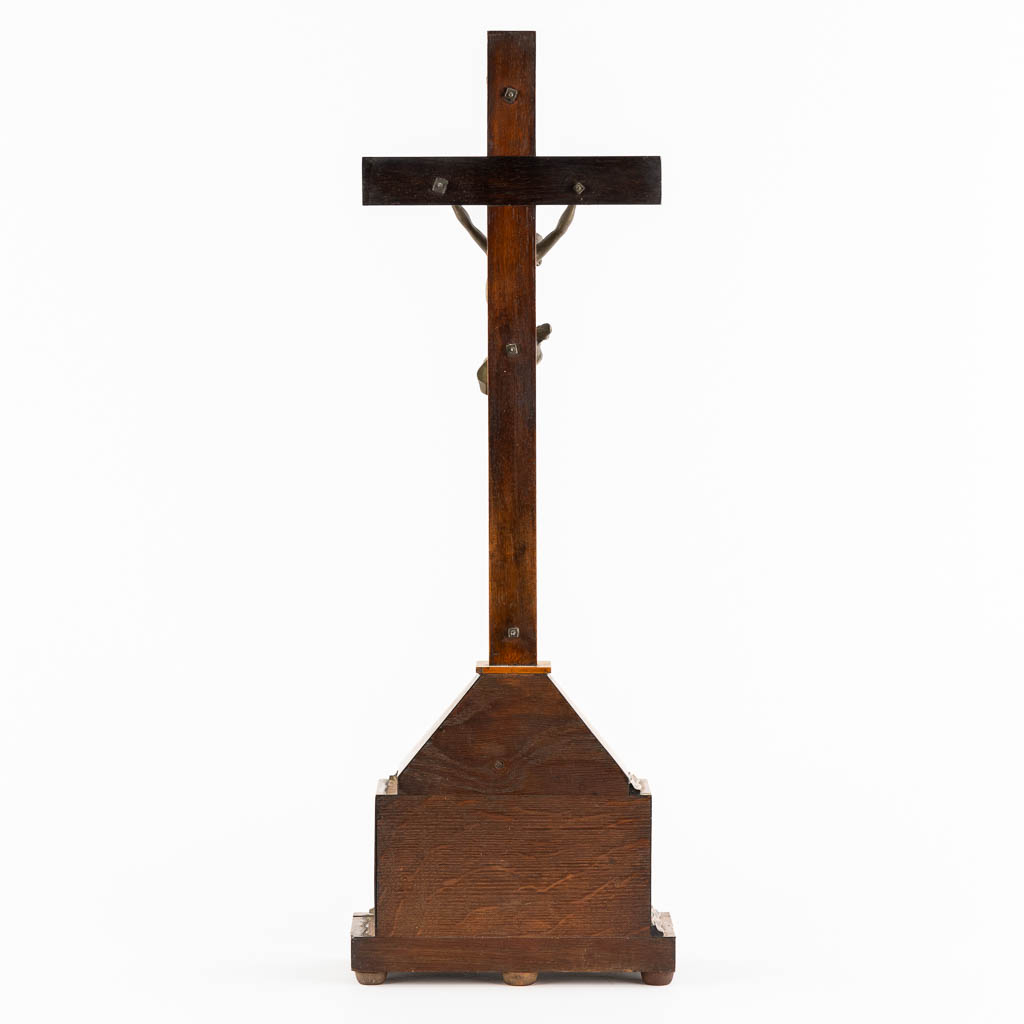 A bronze Corpus Christi mounted on a mahogany and marquetry inlay crucifix.