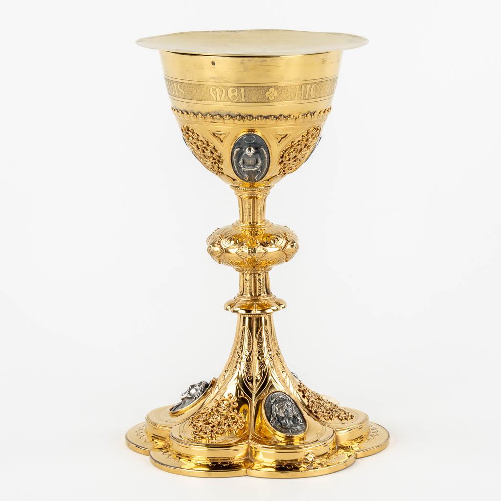 A Gothic Revival chalice with enamel plaques, cabochons. Silver Cuppa, Gilt brass, 19th C.