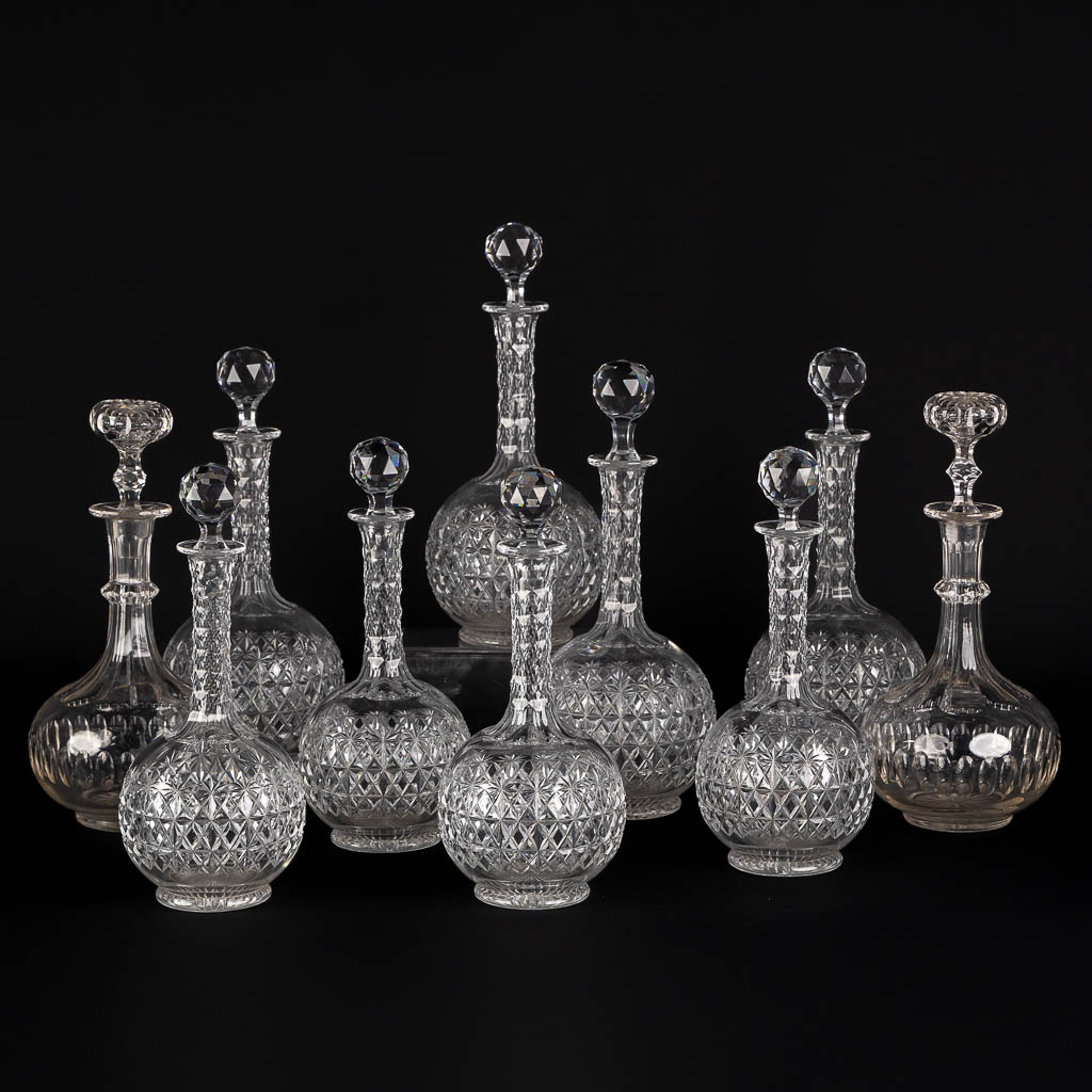 A matching set of 8 caraffes, added are a pair. Cut crystal. (H:34 cm)