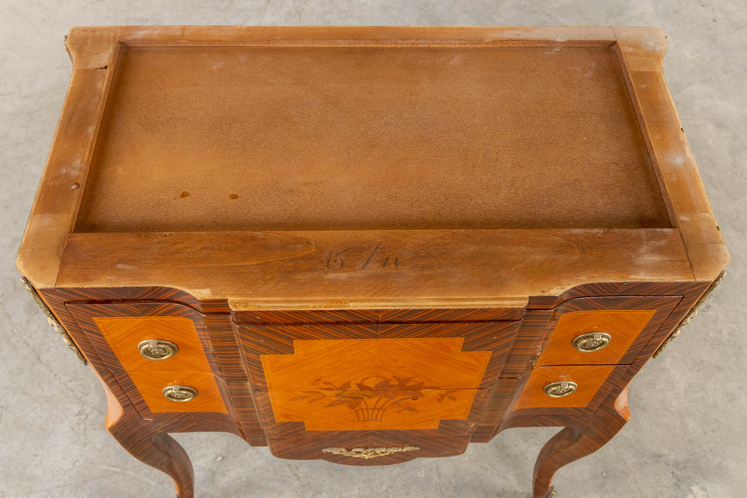 A two drawer side cabinet, marquetry inlay with a marble top. (L:39 x W:72 x H:81 cm)