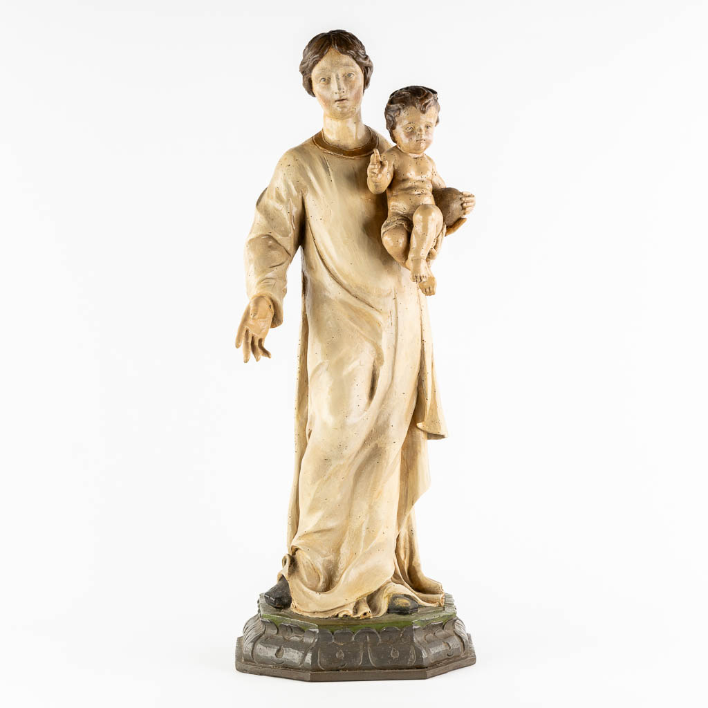 A wood-sculptured and patinated figurine of Madonna with a child. 18th C. (L:33 x W:34 x H:90 cm)