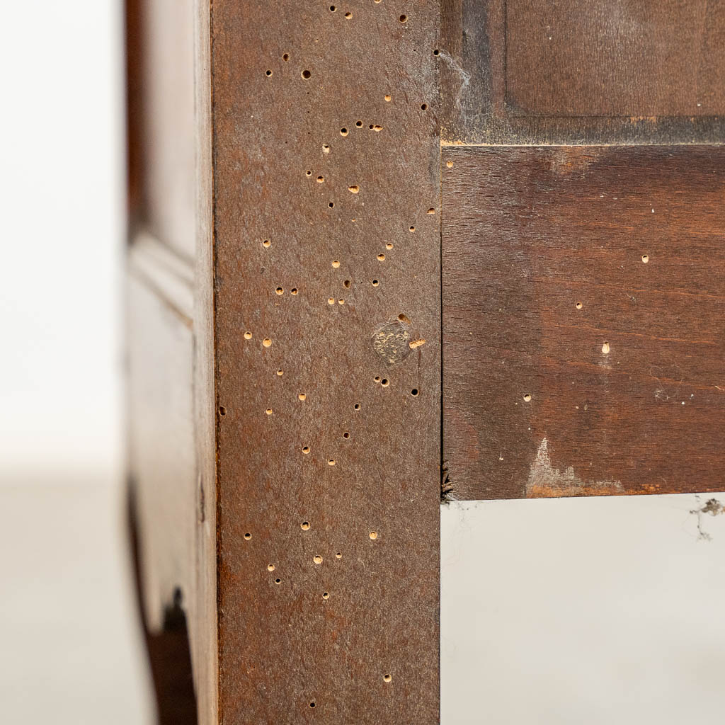 A two door-cabinet, sculptured wood finished with root-wood veneer. 