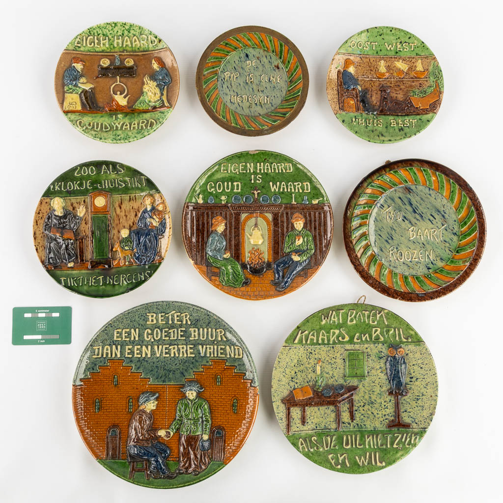 Eight plates with 'Proverbs and Sayings' made of Flemish Earthenware. 