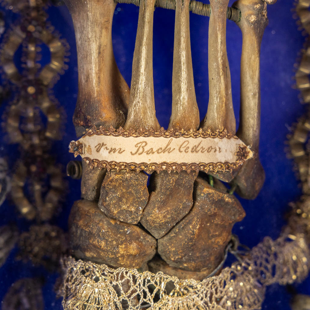 A reliquary cabinet with a relic of a foot, VM. Bach Cedron, dated 1768.