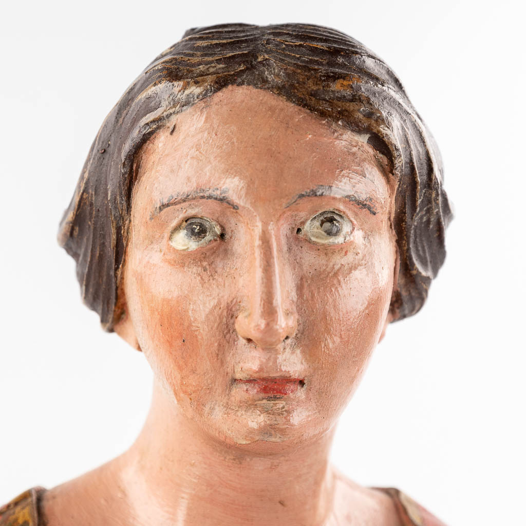 An antique wood-sculptured and polychrome figurine of a noble lady. 18th/19th C. (L: 20 x W: 25 x H: 60 cm)