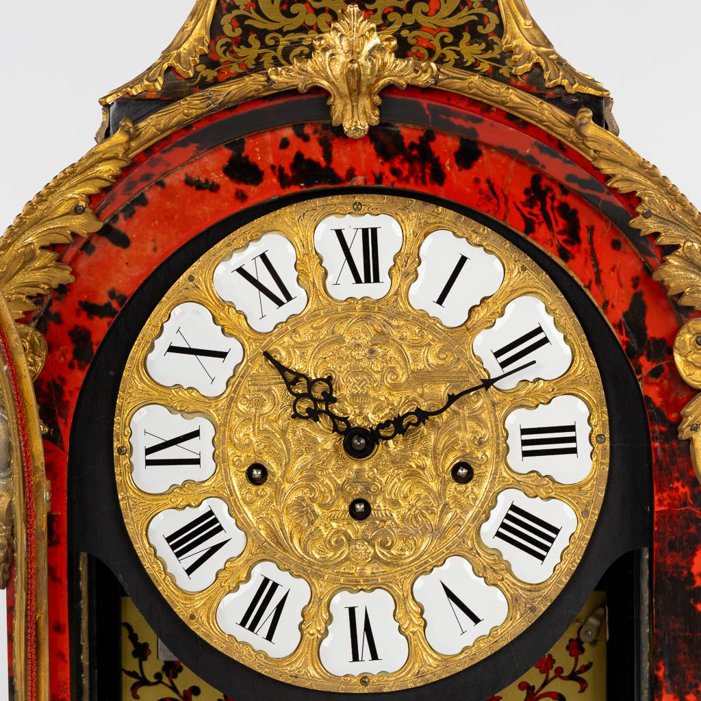 A large cartel clock, Faux Boulle in a Napoleon 3 style, mounted with gilt bronze. 20th C. (L:15 x W:40 x H:85 cm)