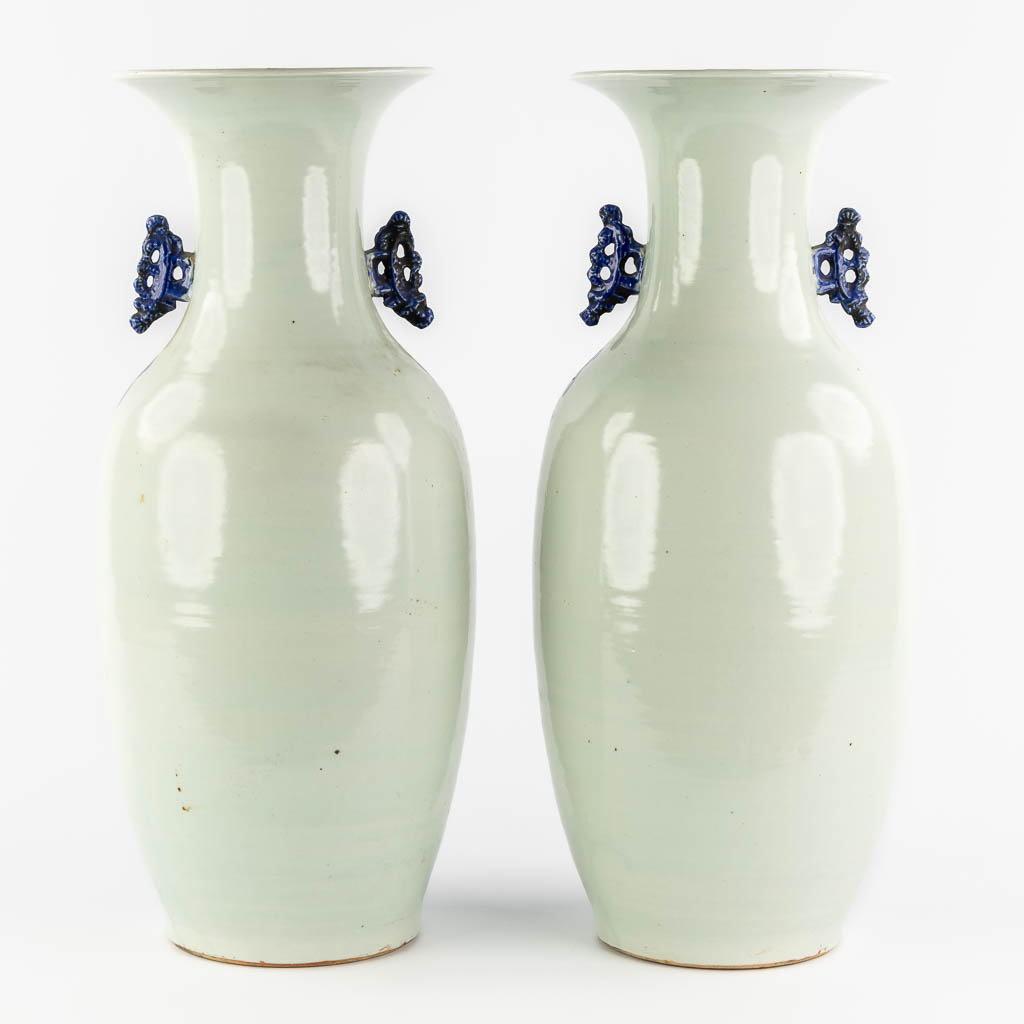 A pair of Chinese vases, blue-white decor of flowers and birds and a fish. (H:57 x D:22 cm)