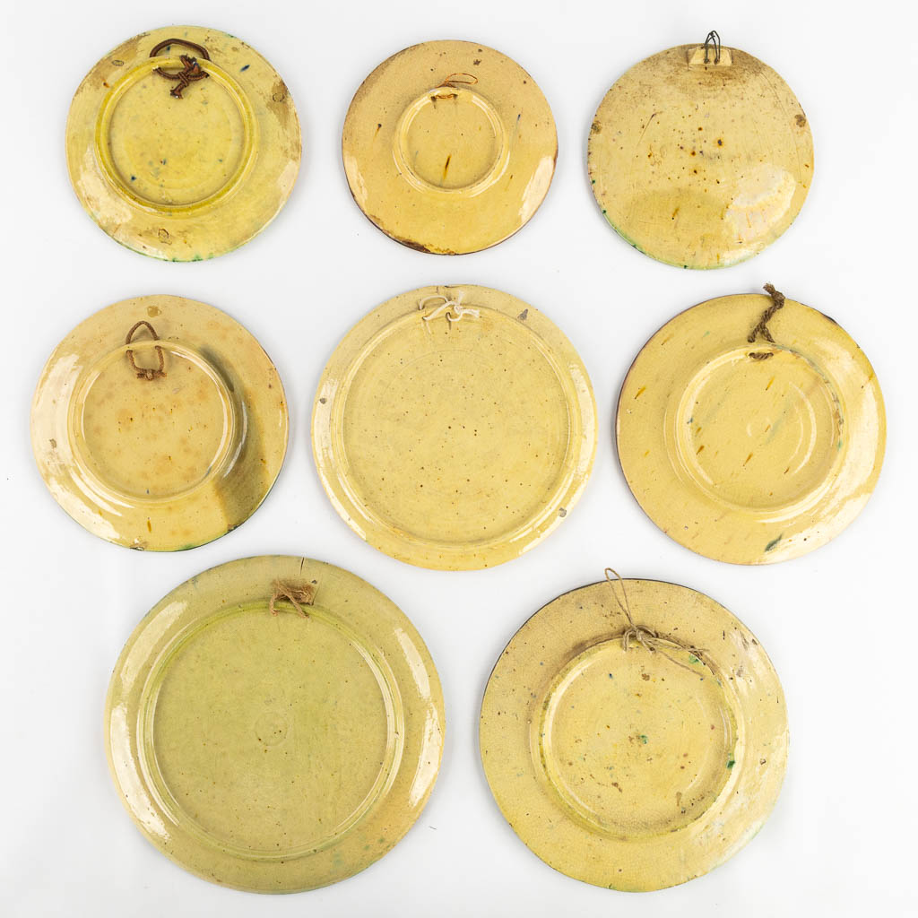 Eight plates with 'Proverbs and Sayings' made of Flemish Earthenware. 