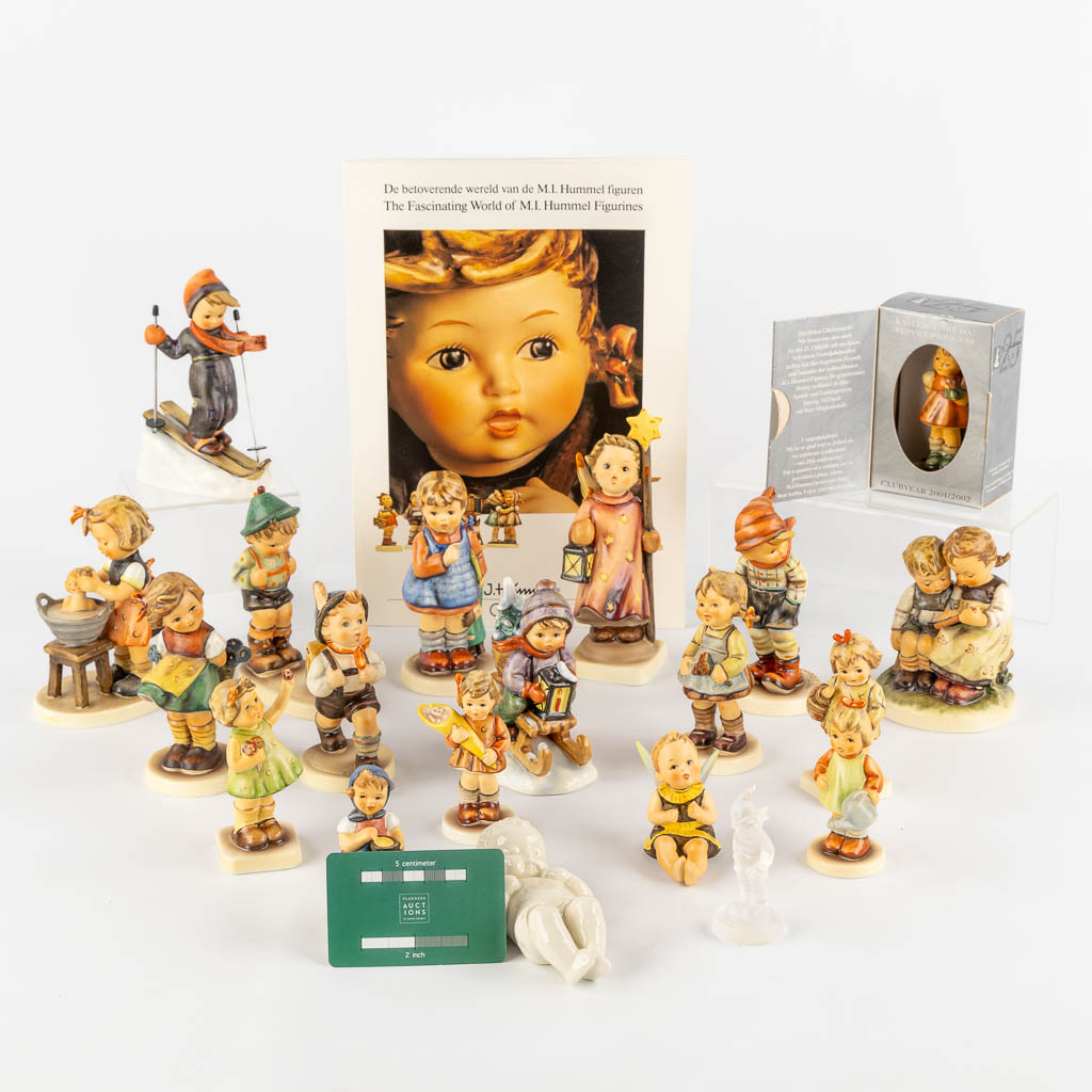 Hummel, a collection of 20 figurines, one made of glass. Added a catalog. (H:17 cm)