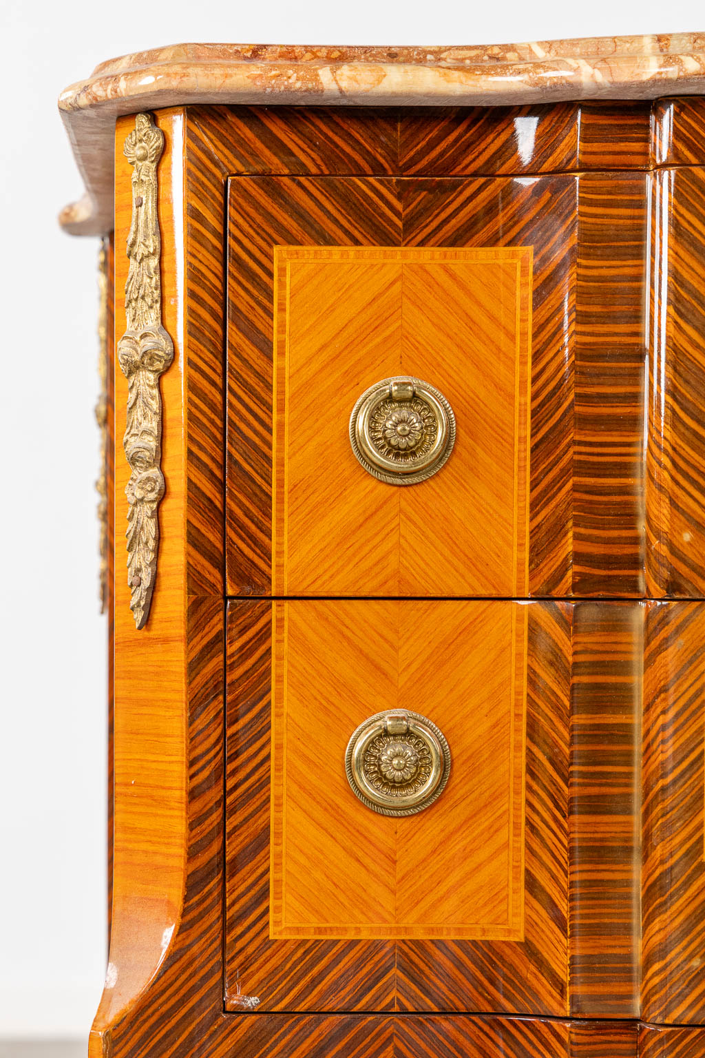 A two drawer side cabinet, marquetry inlay with a marble top. (L:39 x W:72 x H:81 cm)