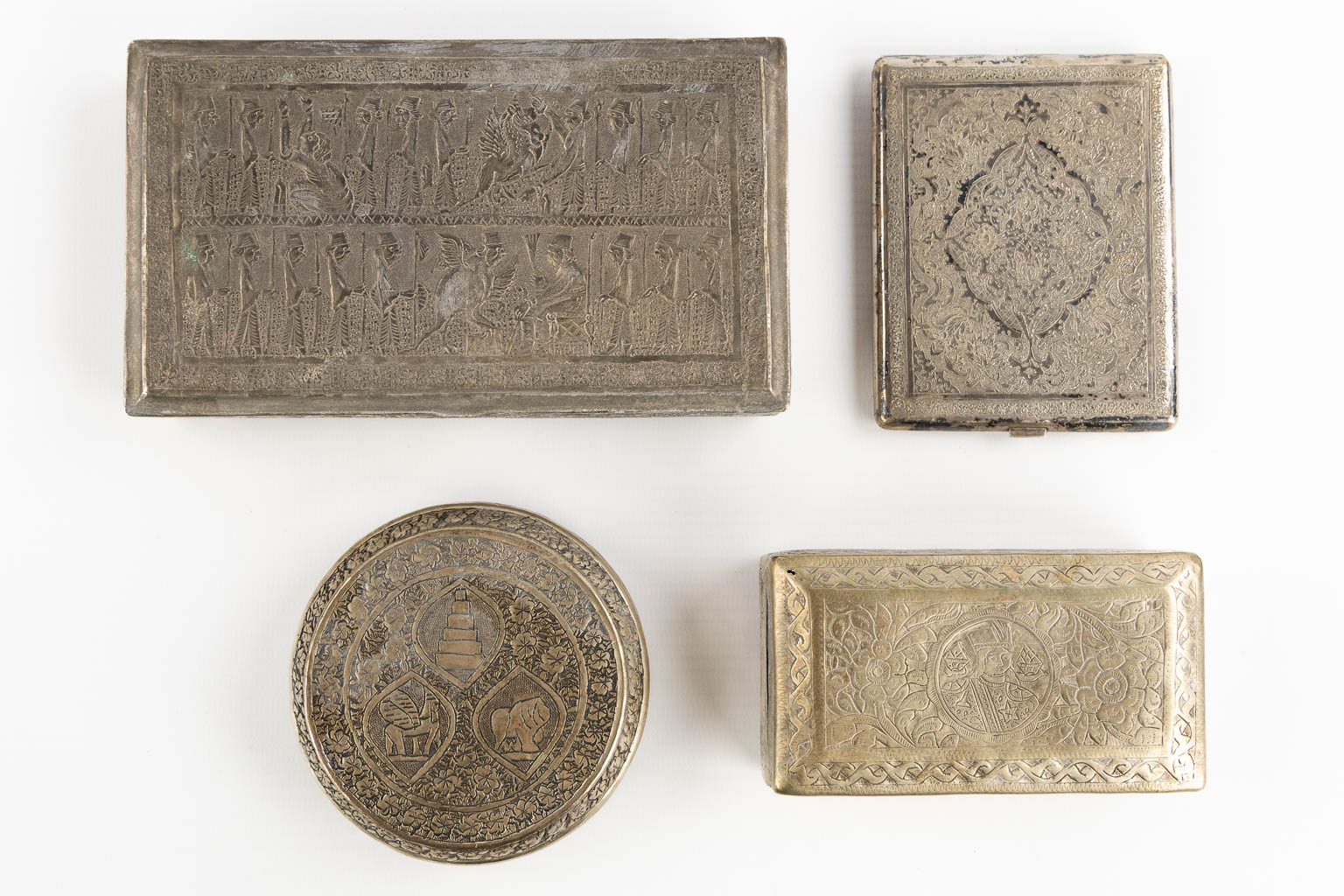 Fourteen Islamic and Indian Amulet or Trinklet boxes, Silver and silver-plate. 19th/20th C. (L:9,5 x W:16,5 x H:2,5 cm)